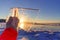 Winter landscape,Sun shines through clear ice chunk in a hand, Lake Baikal, Siberia, Russia