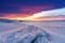 Winter landscape in sunset, Cracked frozen lake covered of snow at lake Baikal in Russia with beautiful sunset sky