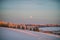 Winter landscape at sunset with forest and moon,