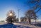 Winter landscape trees snow covered fields windmills