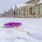 Winter landscape with vibrant sled and snowy homes