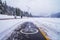 Winter landscape - view of the snowy bike path near the ski resort