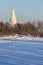 Winter landscape with a white church from unesco world heritage in the Kolomenskoye park, blur and grain effect.