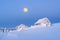 Winter landscape with wooden houses in the frost