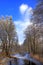 Winter landscape of woods and river covered with ice and snow in Masuria lakes district in Poland - Elk river estuary to Haleckie