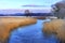 Winter landscape of woods and river covered with ice and snow in Masuria lakes district in Poland - Elk river estuary to Haleckie