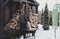 Winter - man taking firewood from woodshed. Country lifestyle and christmas mood