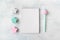 Winter mockup with open white three pastel blue and pink star, notebook and pen