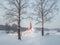 Winter morning frosty dawn. White snowy landscape with old Maltese palace in beautiful natural landscape. Gatchina