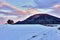 Winter mountain landscape with beautiful blue sky and colorful clouds at dusk