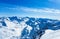 Winter mountain landscape with mountains and blue sky.