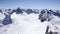 Winter mountain landscape in the Silvretta mountain range in the Swiss Alps with famous Piz Buin mountain peak in the center