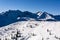 Winter mountain landscape. Slopes and peaks covered with white snow forming a fairy-tale scenery