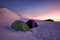 Winter mountain landscape. Tent in sunset light. Tents in the snow - Piatra Mare Mountains, landmark attraction in Romania