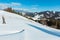 Winter mountain rural snow covered hill slope