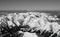 Winter in the mountains. Forests and ridges covered with snow - panorama of the Western Tatras from a height, view from a balloon.