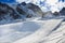 Winter mountains panorama with ski slopes and ski lifts.