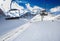 Winter mountains panorama with ski slopes and ski lifts.