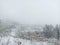 Winter nature. Snow-covered tree branches, the land is covered with a soft layer of white snow. Silence, peace.