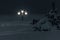 Winter night city Saratov quay bund under snowfall. Street decorative lights in night cityscape