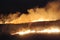 A winter night controlled burn across the plains