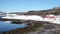 Winter norwegian panorama with the houses on a sea shore