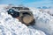 Winter offroad. Jeep in snow snowfall. Off road Adventure.