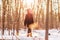 Winter outdoor activity healthy young Asian girl walking in woods outside exercise for active lifestyle. Trail walk in