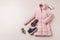 Winter outfit for women - pastel pink down jacket and boots