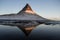 Winter panorama mirror reflection of Kirkjufell mountain blue hour sunrise Grundarfjordur Snaefellsnes Peninsula Iceland