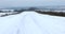 Winter panoramic landscape with road and fields