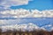 Winter Panoramic view of Snow capped Wasatch Front Rocky Mountains, Great Salt Lake Valley and Cloudscape. Utah