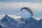 Winter paragliding over mountain peaks
