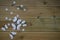 Winter photography image of white winter snowflakes and fun toy butterflies on rustic wood background and space