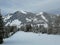 Winter pines and snow-capped mountains in Hoch-Ybrig, Switzerland.