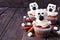 Winter Polar Bear cupcakes on a rustic dark wood table