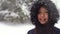 Winter portrait of beautiful smiling Asian teen girl in snow
