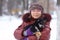 Winter portrait of a girl and puppy