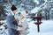 Winter portrait of happy romantic couple embracing and looking to each other outdoor in snowy day