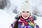 Winter portrait of little girl in warm clothes