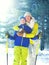 Winter portrait of mother hugs her son child on a ski