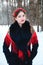 Winter portreit smiling girl with beautiful hair on her head in Russian folk style in red shawls