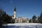 Winter in public park with church in Cham, Switzerland