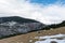 Winter Pyrenees landscape: snow-covered meadow and icy mountain peaks on background, Pyrenees, Spain