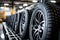 Winter-ready tires in a tire shop, neatly stacked and awaiting installation