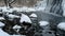 Winter River Serene video of a snow-covered river with icy stones