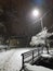 Winter road bridge snowing under light