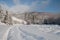 Winter road. Carpathian Mountains. Natural landscape with beautiful sky.