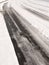 Winter road through uk estate tracks no cars empty path snow