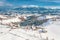 Winter in Romania with the Carpathian Mountains visible in the back and Pestera traditional village in the foreground